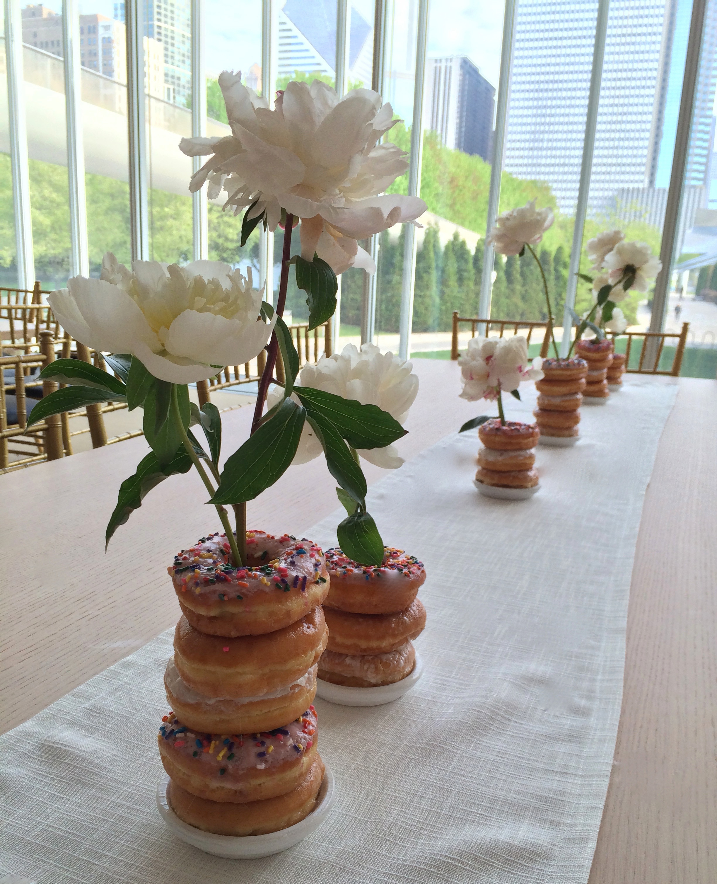 Donut vases at the New Modern Wing Cornelia McNamara Flowers